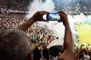 Person Taking Photo of Stage Stadium Presentation.